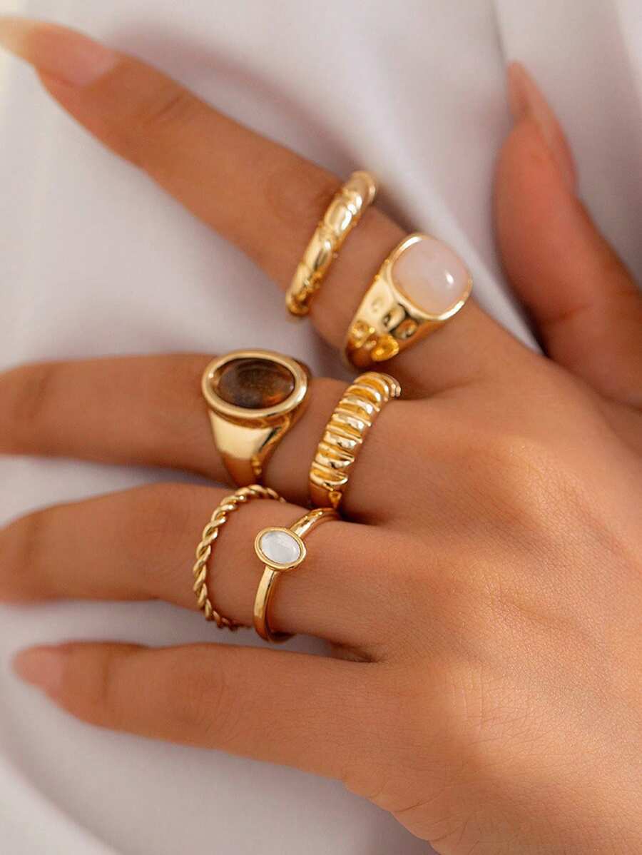 Juego de 13 anillos de metal líquido solar con textura asimétrica fluida o martillada