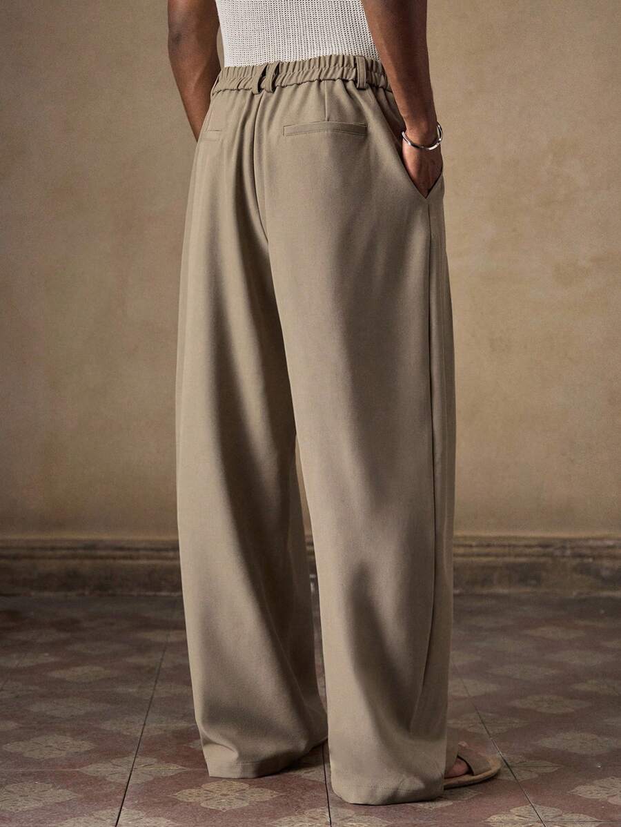 Pantalones de cintura alta y pierna ancha para hombre con frente plisado