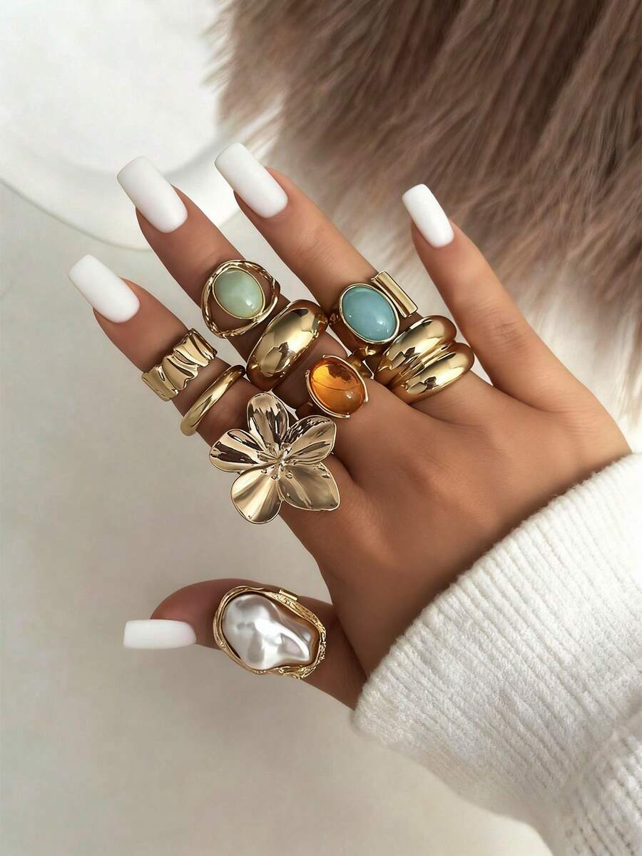 Juego de 13 anillos de metal líquido solar con textura asimétrica fluida o martillada