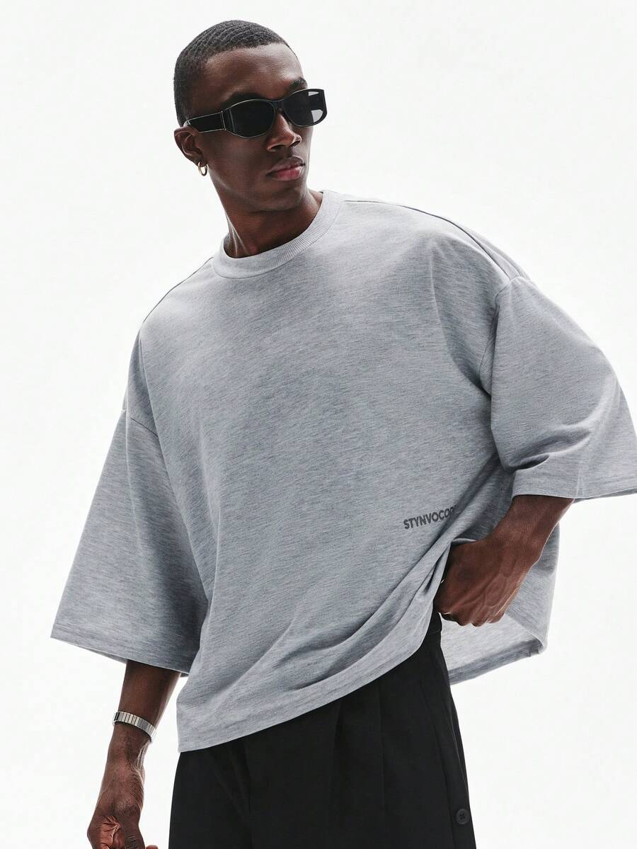 Camiseta suelta de hombro caído con estampado de letras casual para hombre
