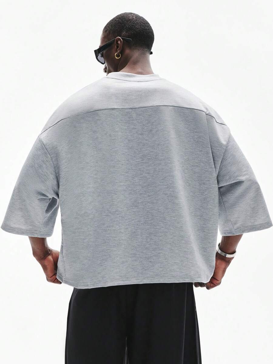 Camiseta suelta de hombro caído con estampado de letras casual para hombre