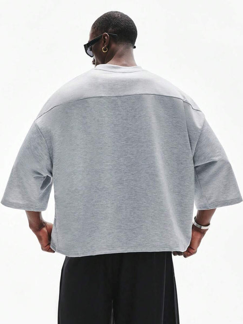 Camiseta suelta de hombro caído con estampado de letras casual para hombre