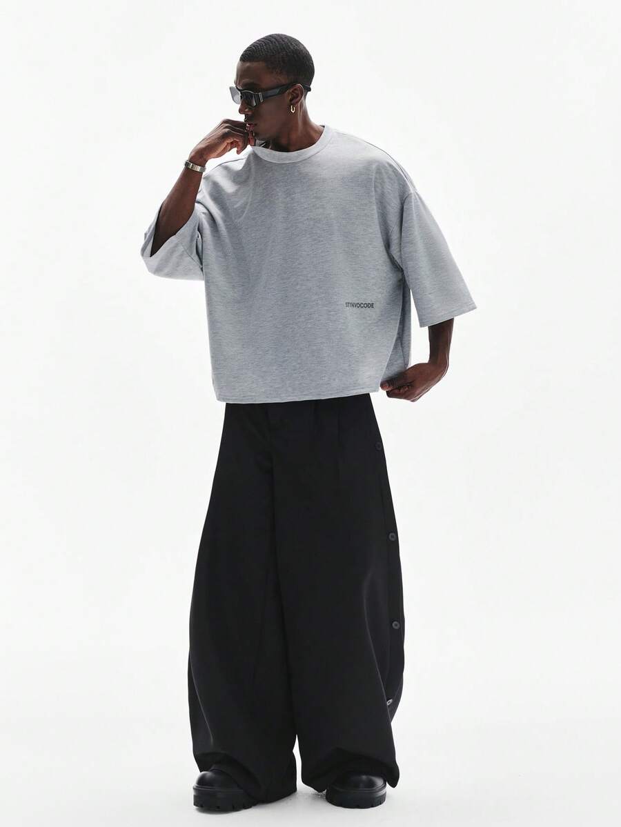 Camiseta suelta de hombro caído con estampado de letras casual para hombre
