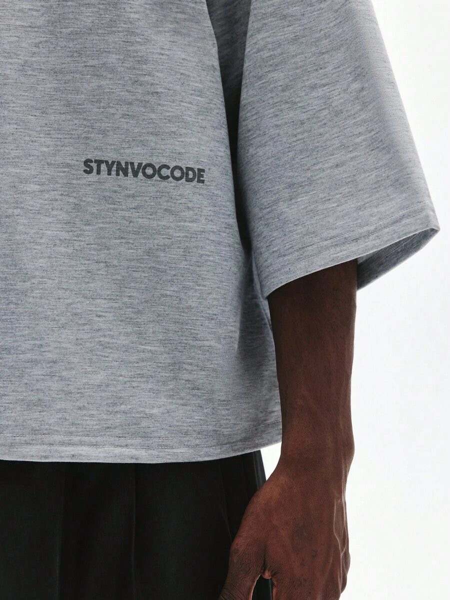 Camiseta suelta de hombro caído con estampado de letras casual para hombre