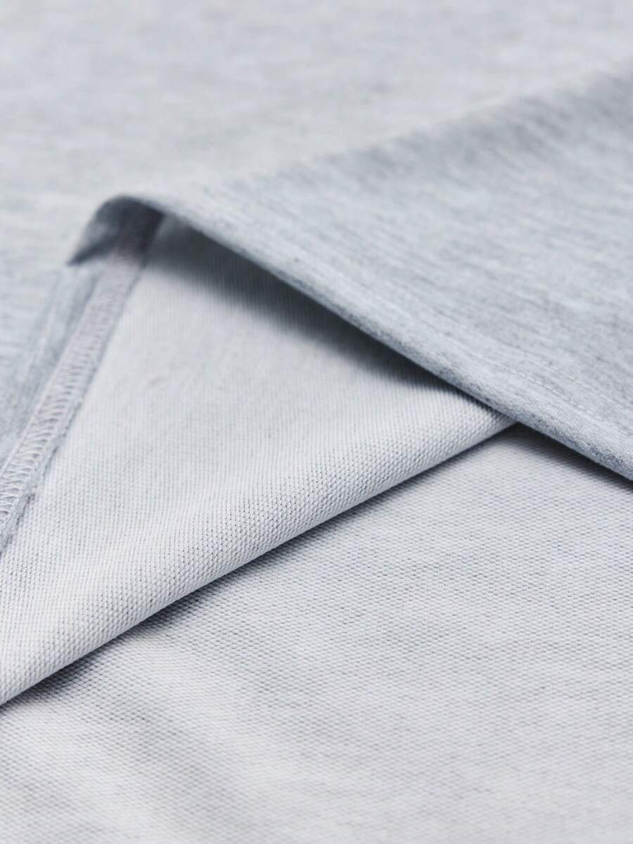 Camiseta suelta de hombro caído con estampado de letras casual para hombre