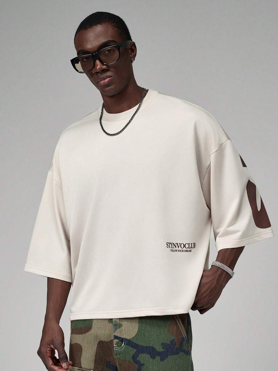 Camiseta suelta de hombro caído con estampado de letras casual para hombre