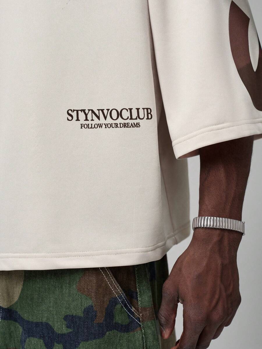 Camiseta suelta de hombro caído con estampado de letras casual para hombre