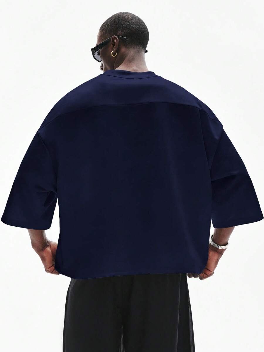 Camiseta suelta de hombro caído con estampado de letras casual para hombre