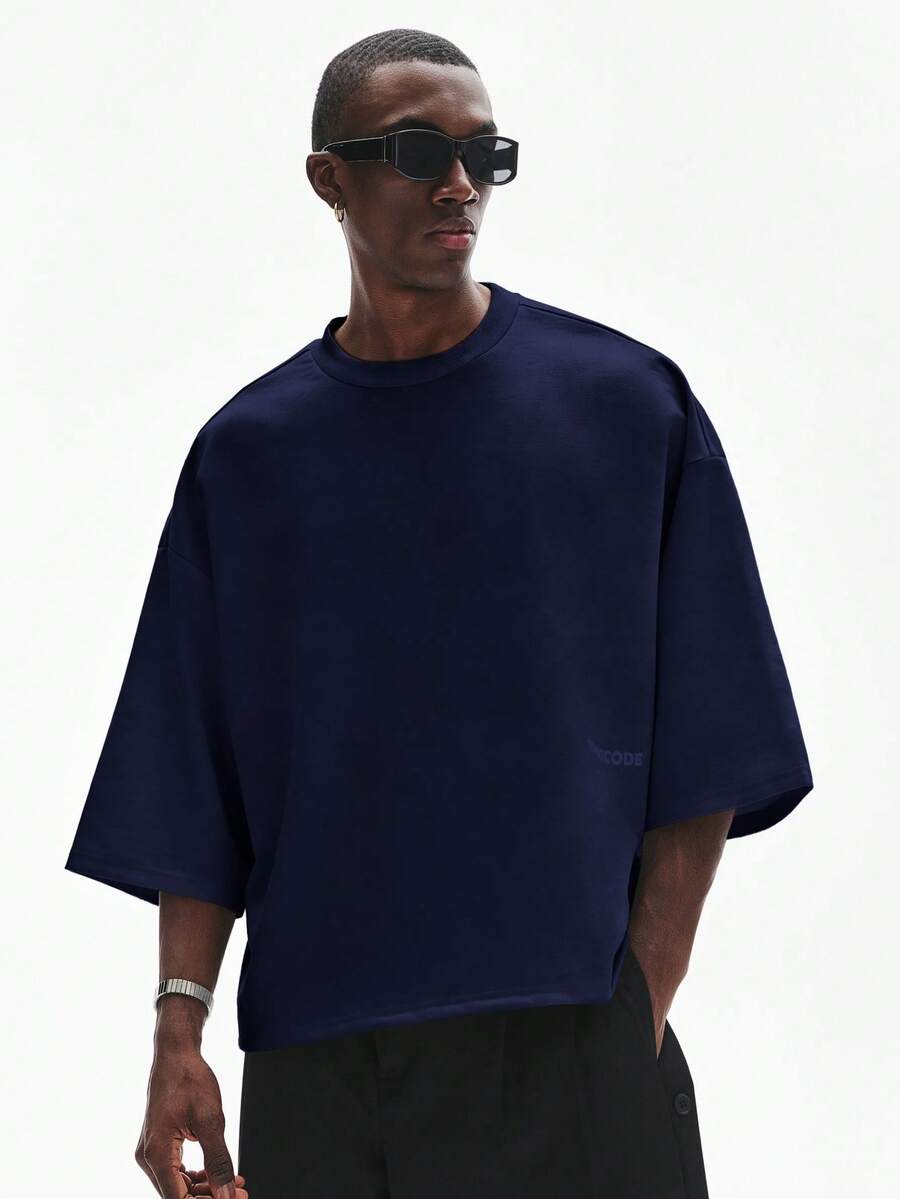 Camiseta suelta de hombro caído con estampado de letras casual para hombre