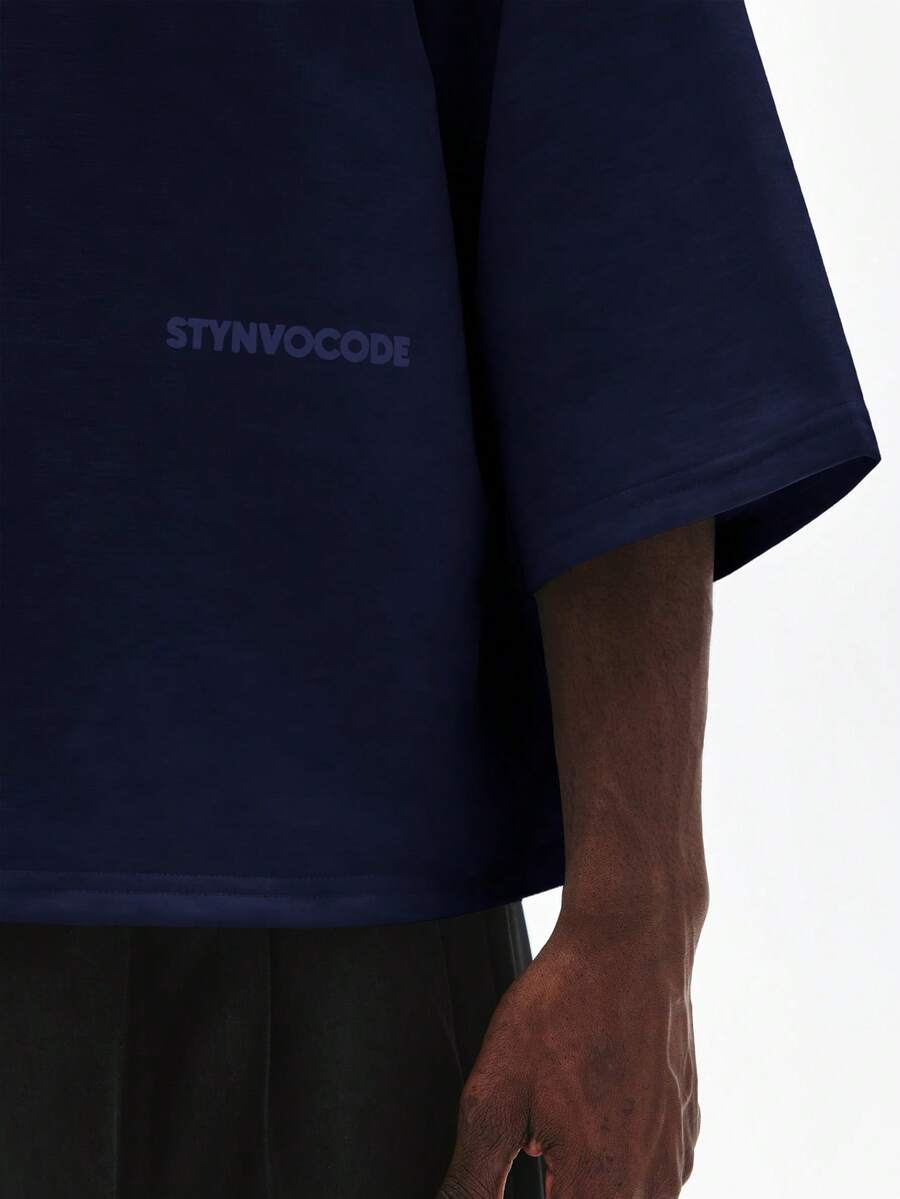 Camiseta suelta de hombro caído con estampado de letras casual para hombre