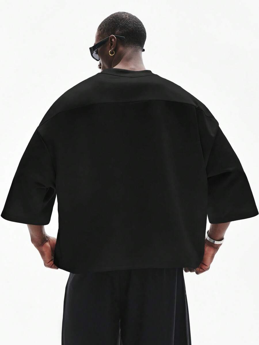Camiseta suelta de hombro caído con estampado de letras casual para hombre