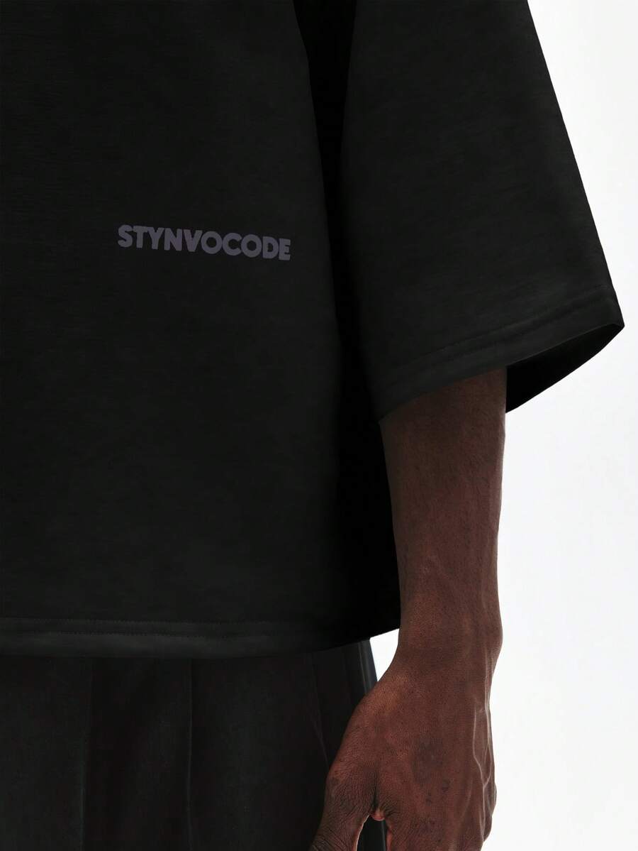 Camiseta suelta de hombro caído con estampado de letras casual para hombre