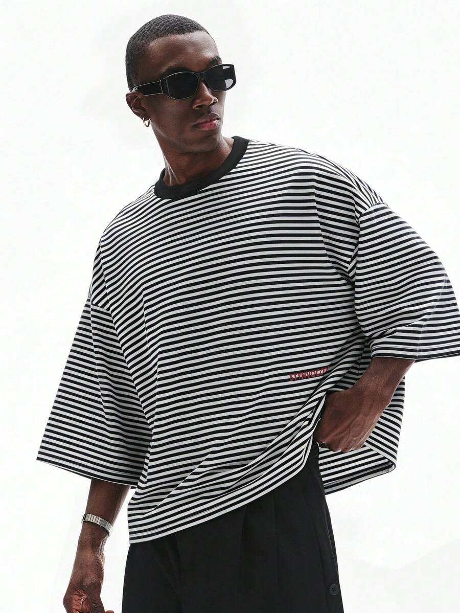 Camiseta suelta de hombro caído con estampado de letras casual para hombre