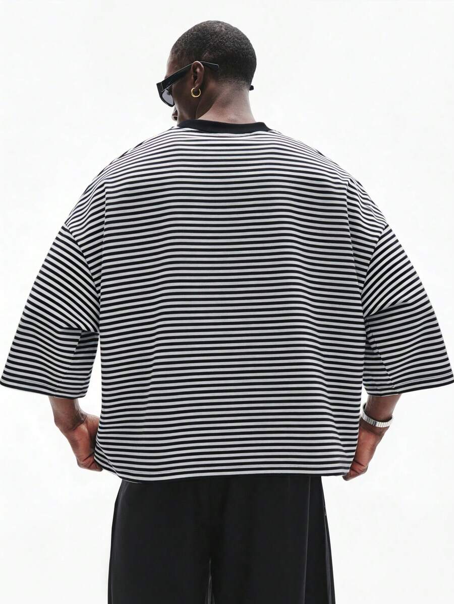 Camiseta suelta de hombro caído con estampado de letras casual para hombre