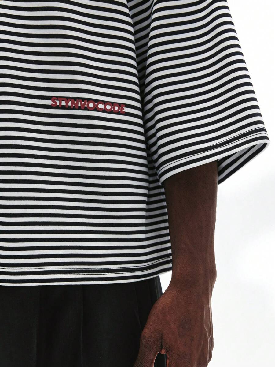 Camiseta suelta de hombro caído con estampado de letras casual para hombre