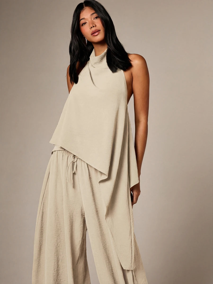 Conjunto de dos piezas con top de cuello  y pantalón  globo con lunares dorados