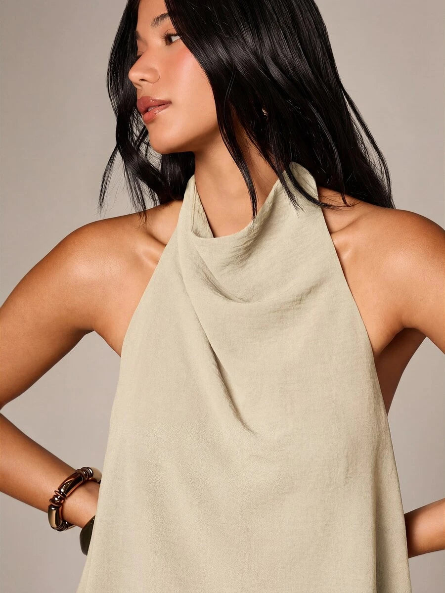Conjunto de dos piezas con top de cuello  y pantalón  globo con lunares dorados