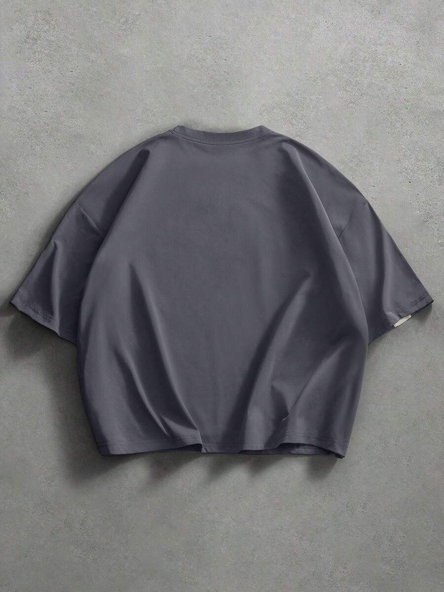 Camiseta suelta de hombro caído con estampado de letras casual para hombre
