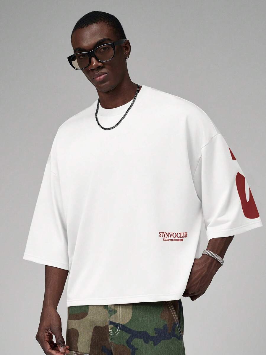 Camiseta suelta de hombro caído con estampado de letras casual para hombre