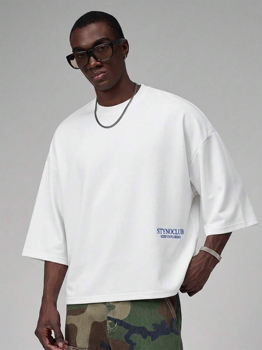 Camiseta suelta de hombro caído con estampado de letras casual para hombre