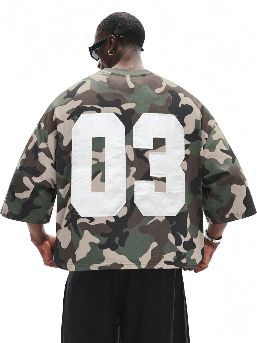 Camiseta suelta de hombro caído con estampado de letras casual para hombre