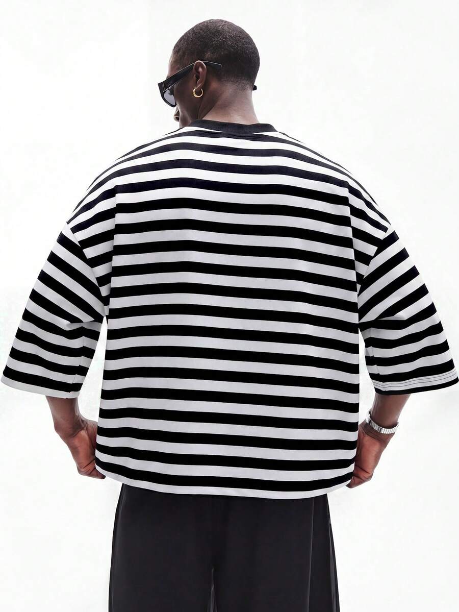 Camiseta suelta de hombro caído con estampado de letras casual para hombre