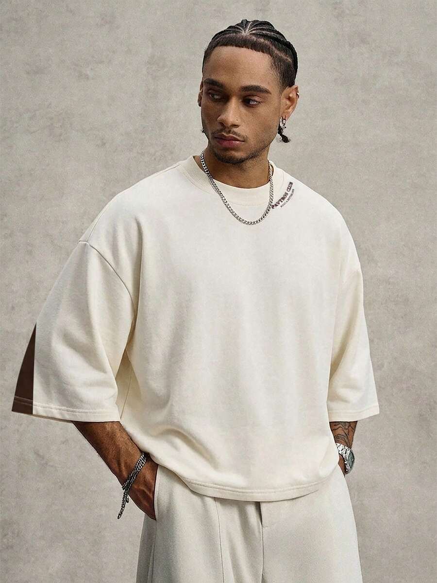 Camiseta suelta de hombro caído con estampado de letras casual para hombre