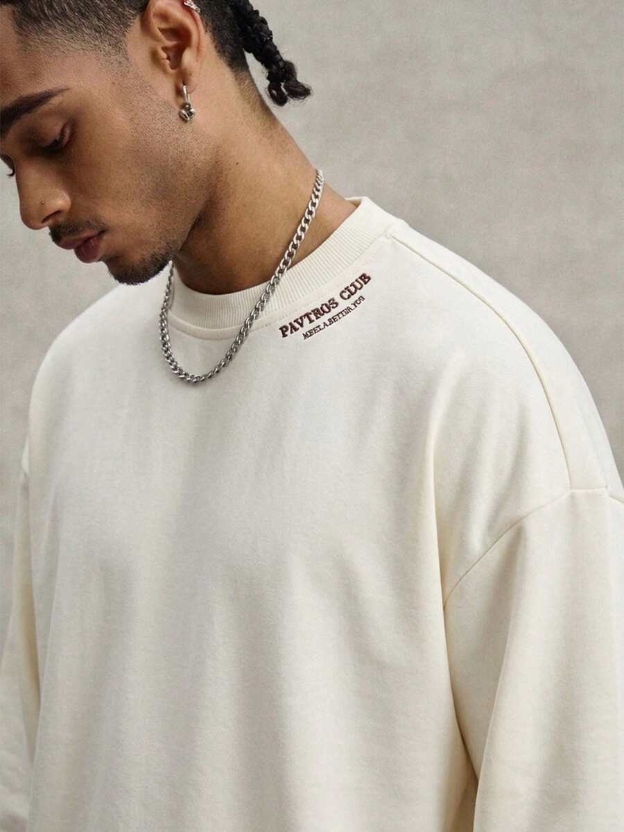 Camiseta suelta de hombro caído con estampado de letras casual para hombre