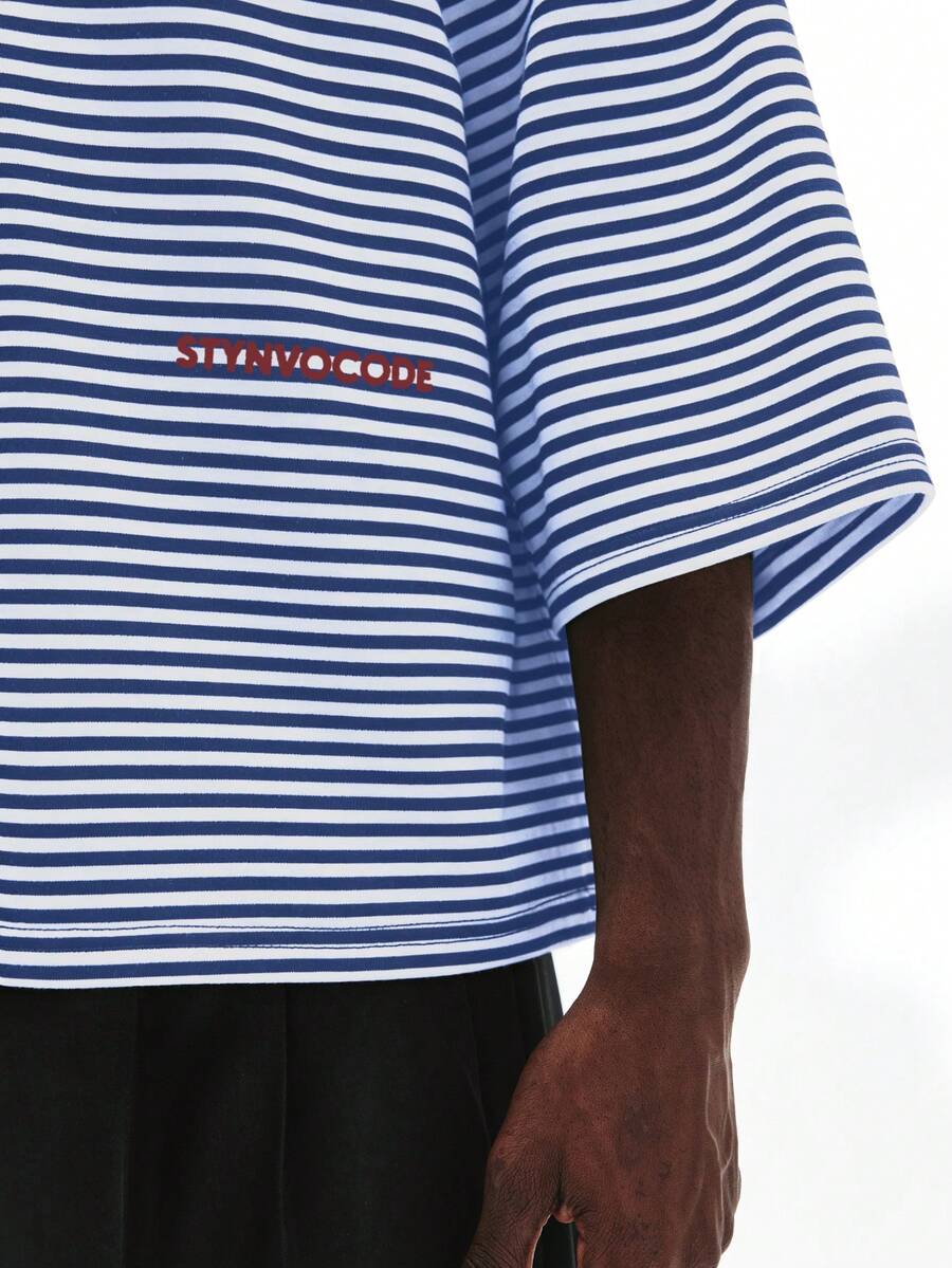 Camiseta suelta de hombro caído con estampado de letras casual para hombre