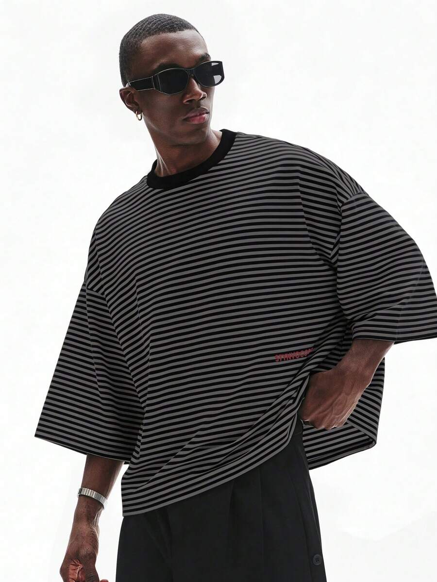Camiseta suelta de hombro caído con estampado de letras casual para hombre