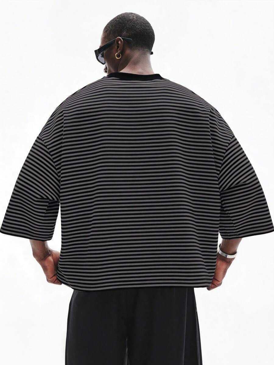 Camiseta suelta de hombro caído con estampado de letras casual para hombre