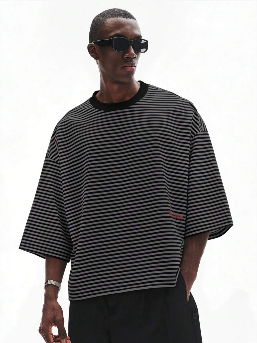 Camiseta suelta de hombro caído con estampado de letras casual para hombre