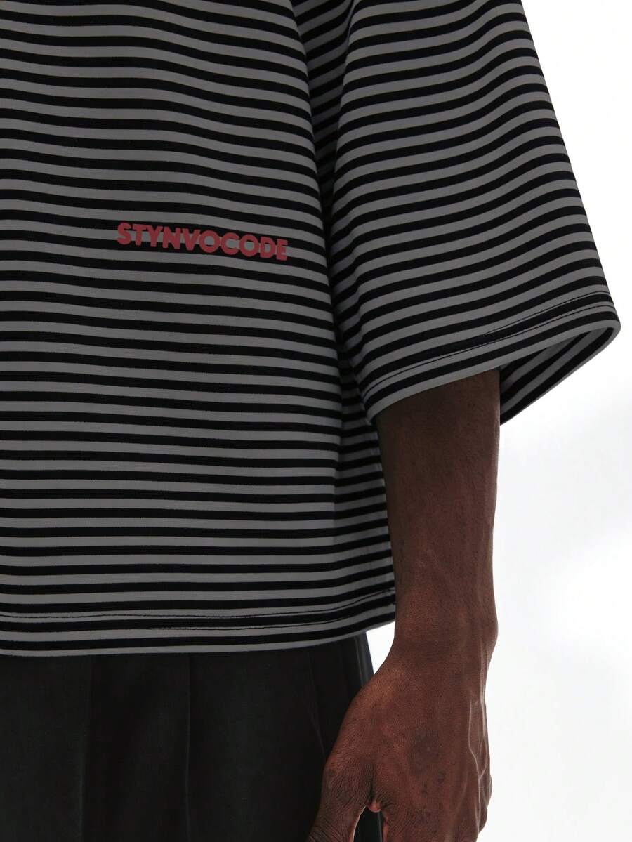 Camiseta suelta de hombro caído con estampado de letras casual para hombre