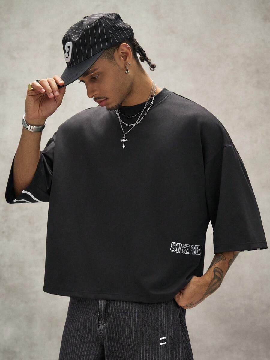 Camiseta suelta de hombro caído con estampado de letras casual para hombre