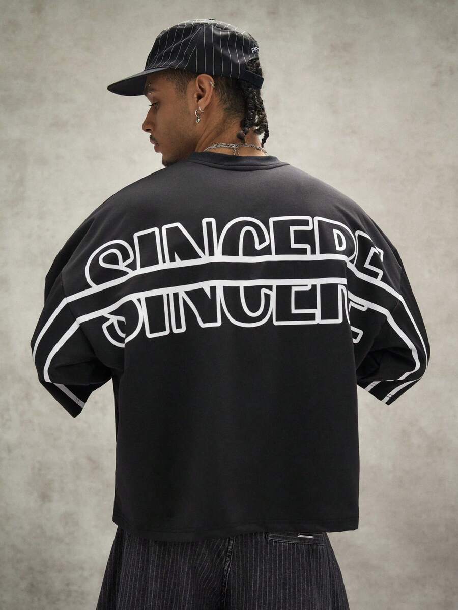 Camiseta suelta de hombro caído con estampado de letras casual para hombre