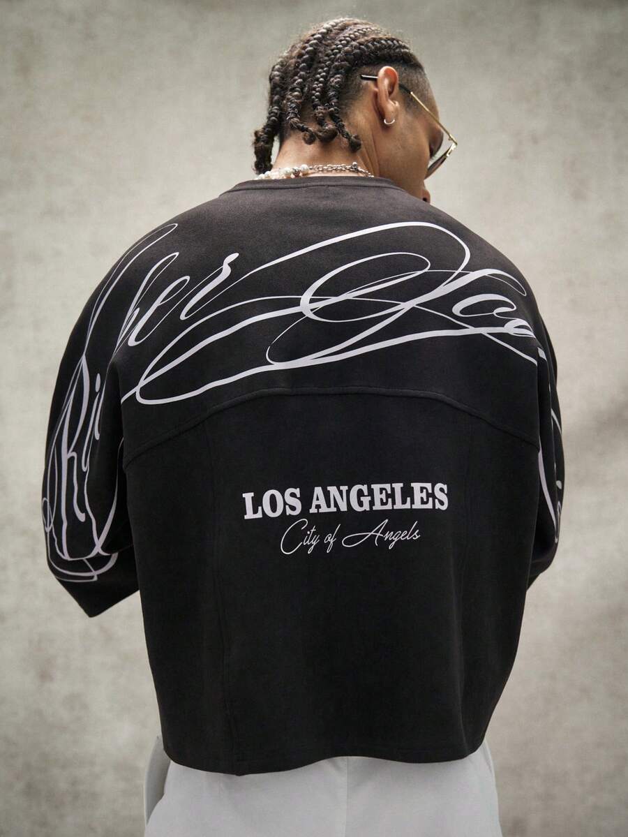 Camiseta suelta de hombro caído con estampado de letras casual para hombre