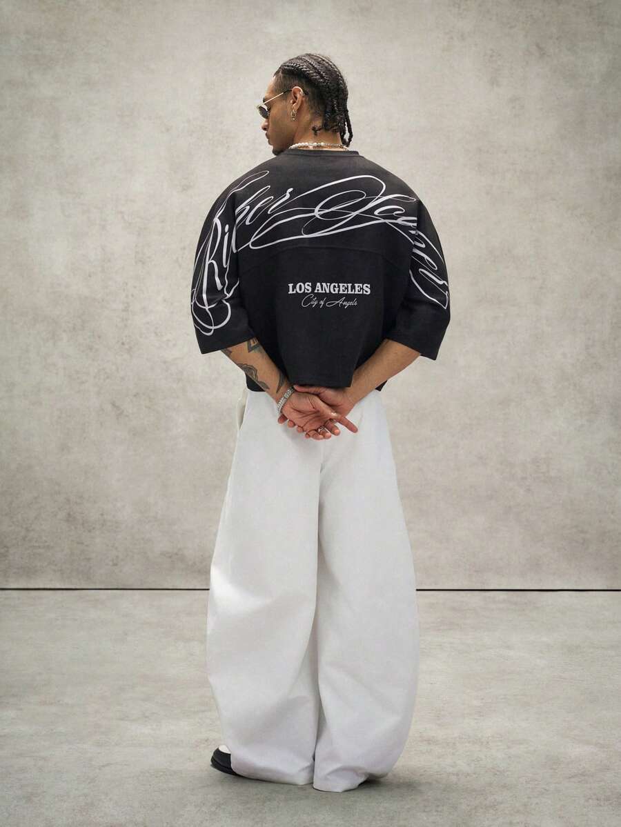 Camiseta suelta de hombro caído con estampado de letras casual para hombre