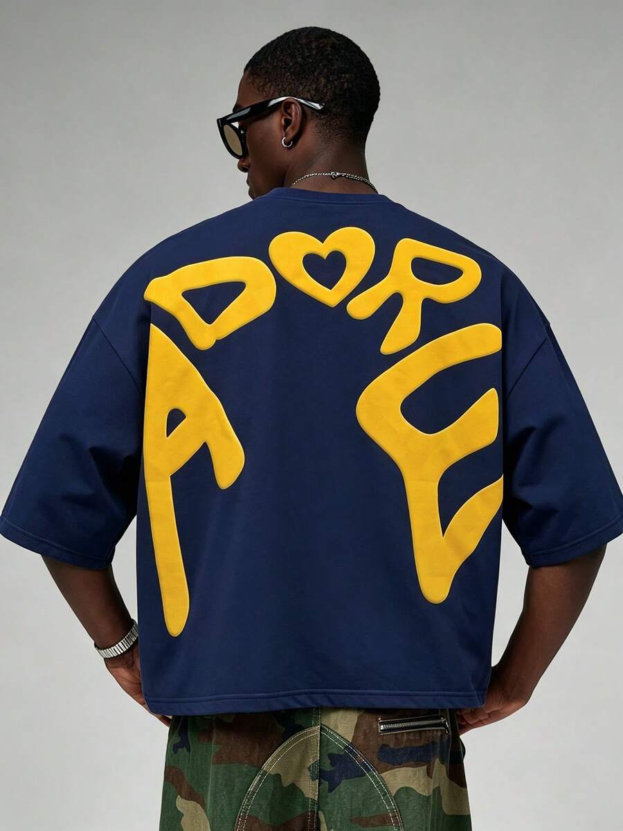 Camiseta suelta de hombro caído con estampado de letras casual para hombre