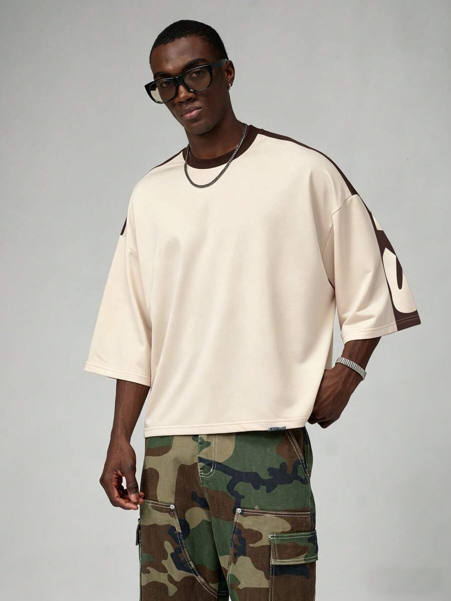 Camiseta suelta de hombro caído con estampado de letras casual para hombre