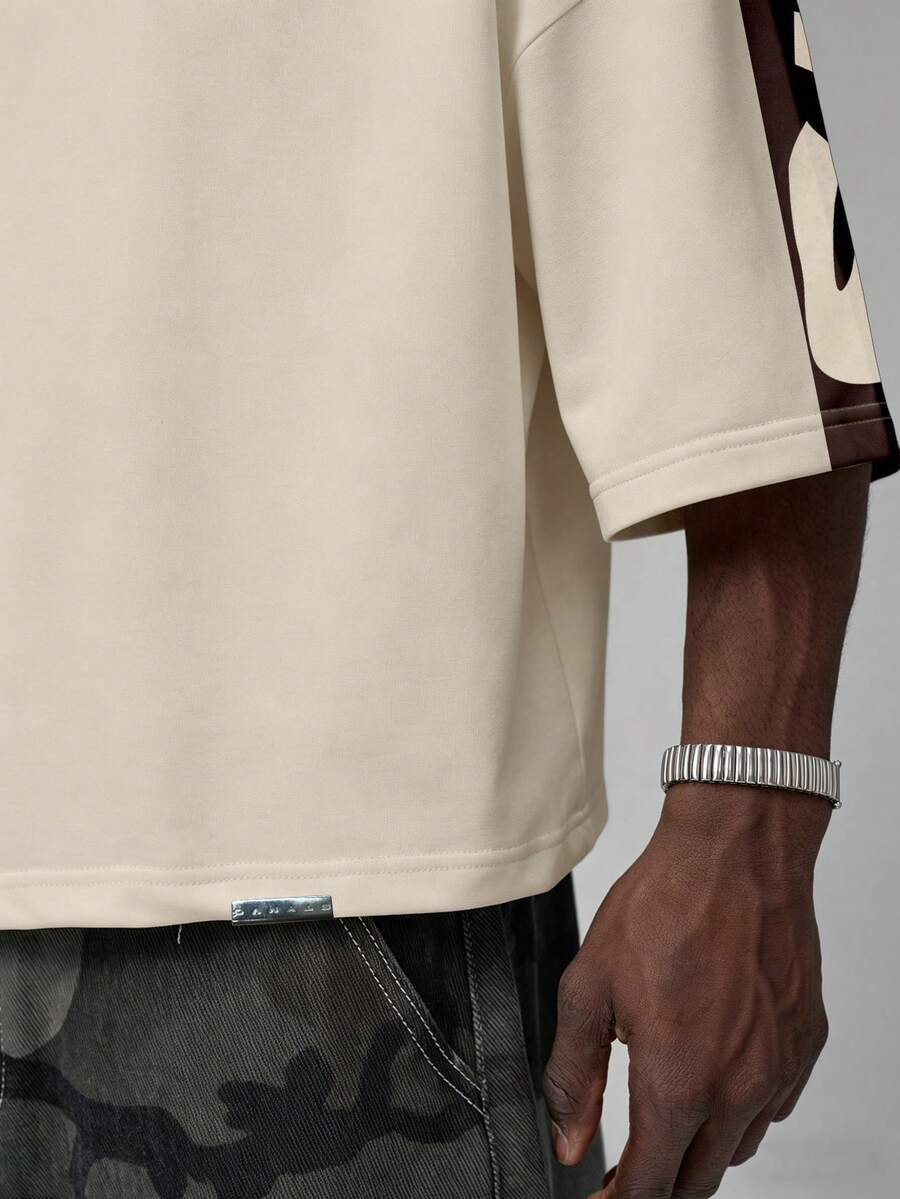 Camiseta suelta de hombro caído con estampado de letras casual para hombre