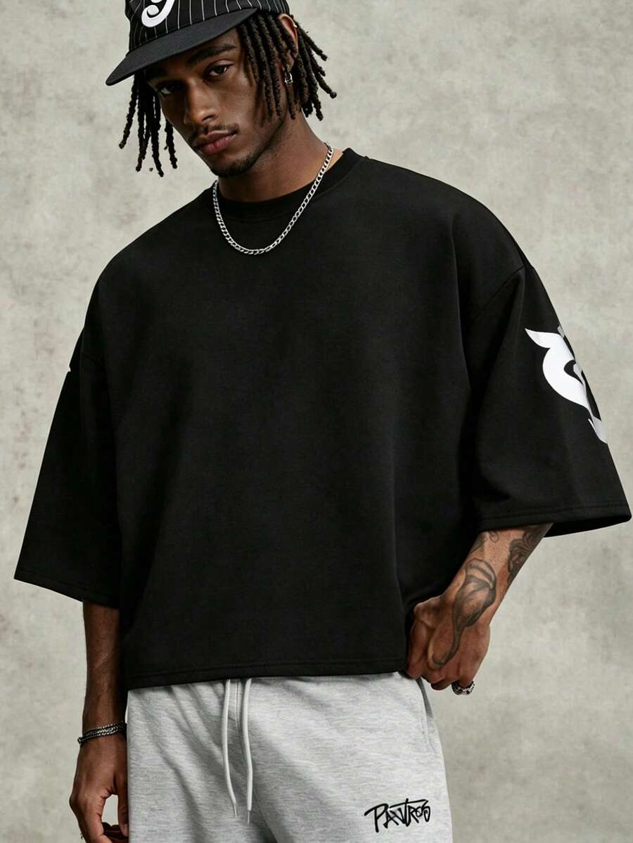Camiseta suelta de hombro caído con estampado de letras casual para hombre