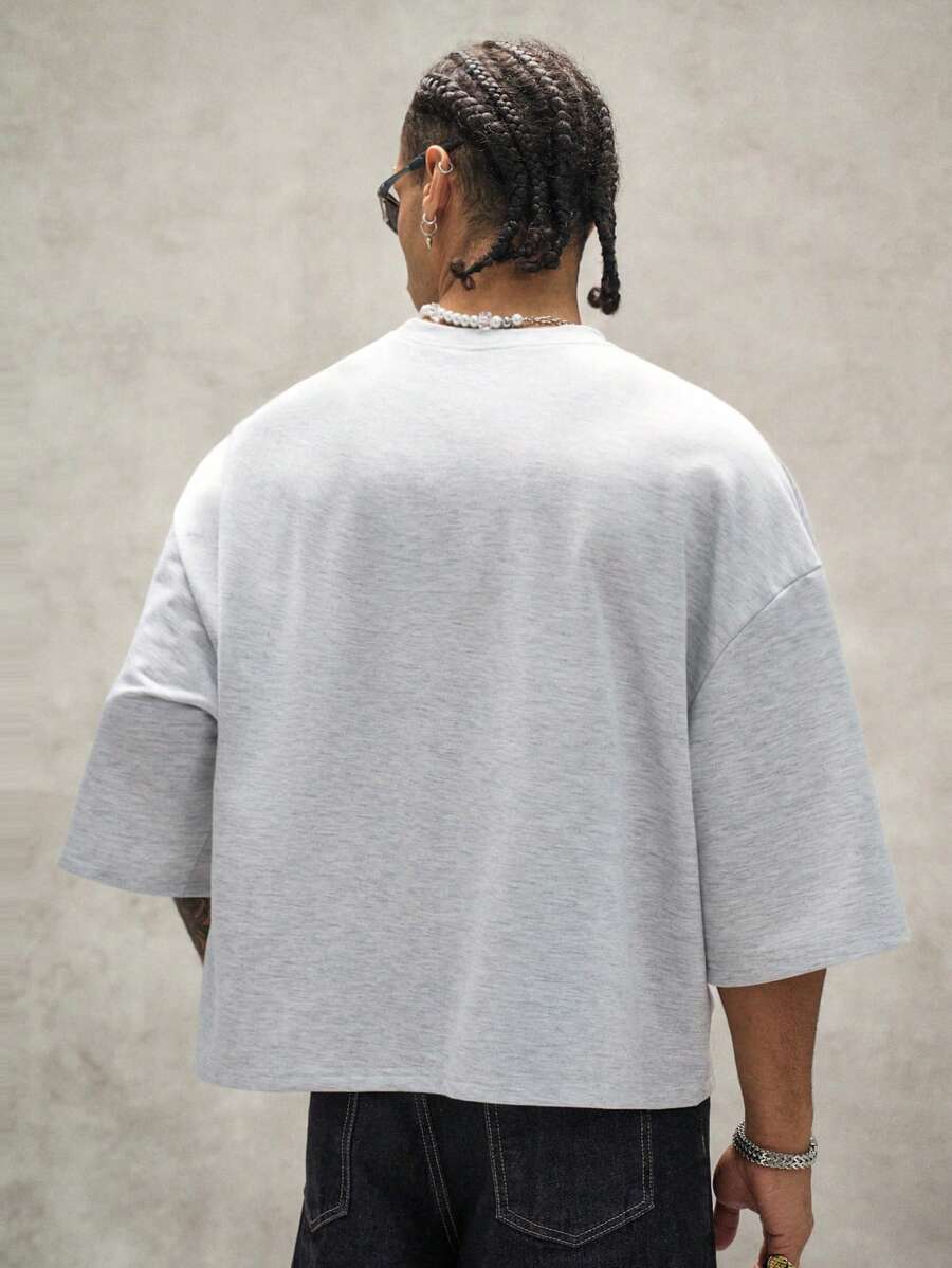 Camiseta suelta de hombro caído con estampado de letras casual para hombre