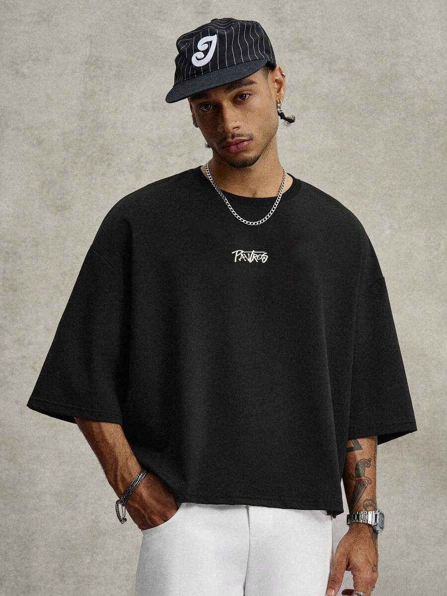 Camiseta suelta de hombro caído con estampado de letras casual para hombre