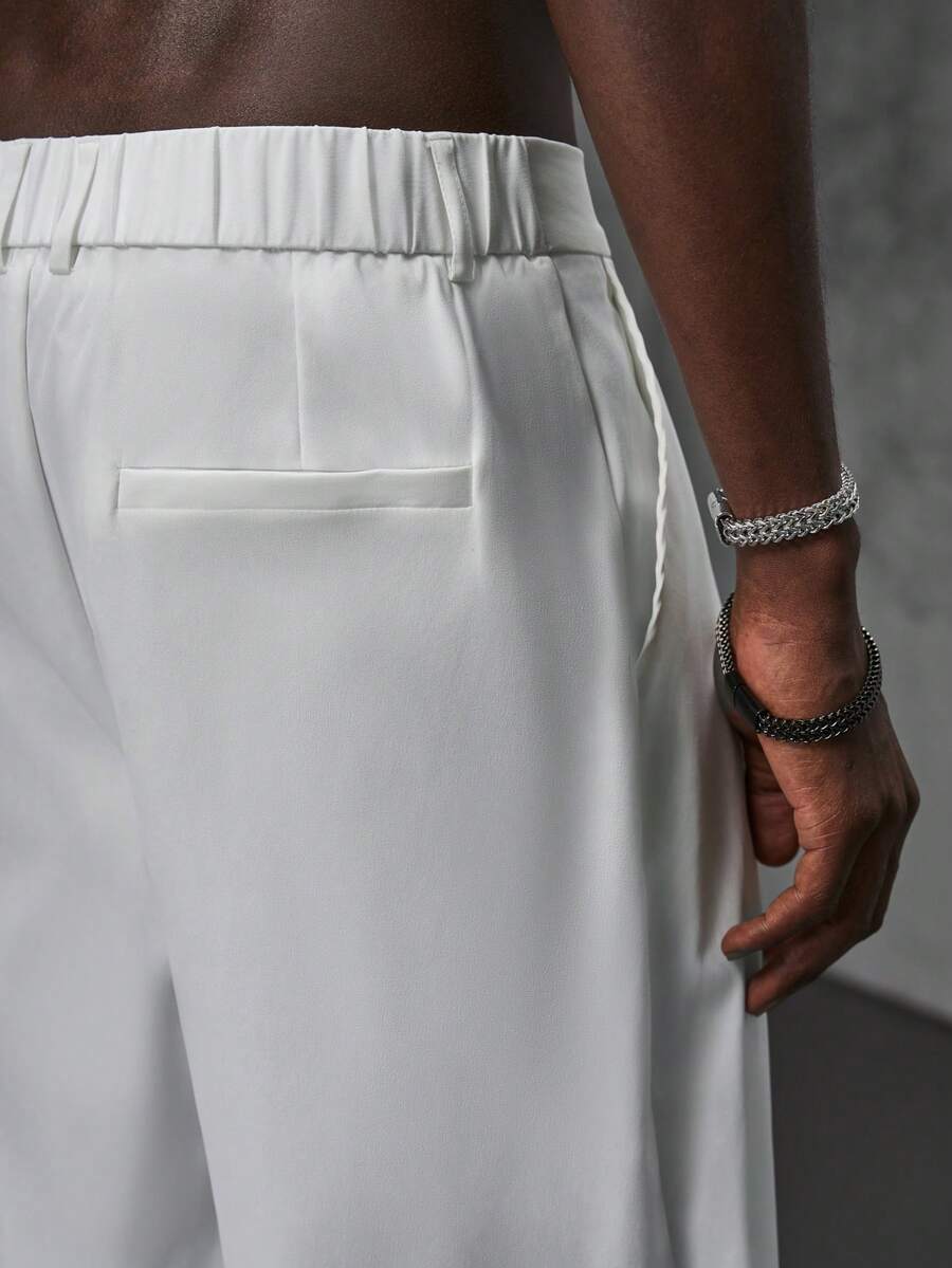 Pantalones de cintura alta y pierna ancha para hombre con frente plisado