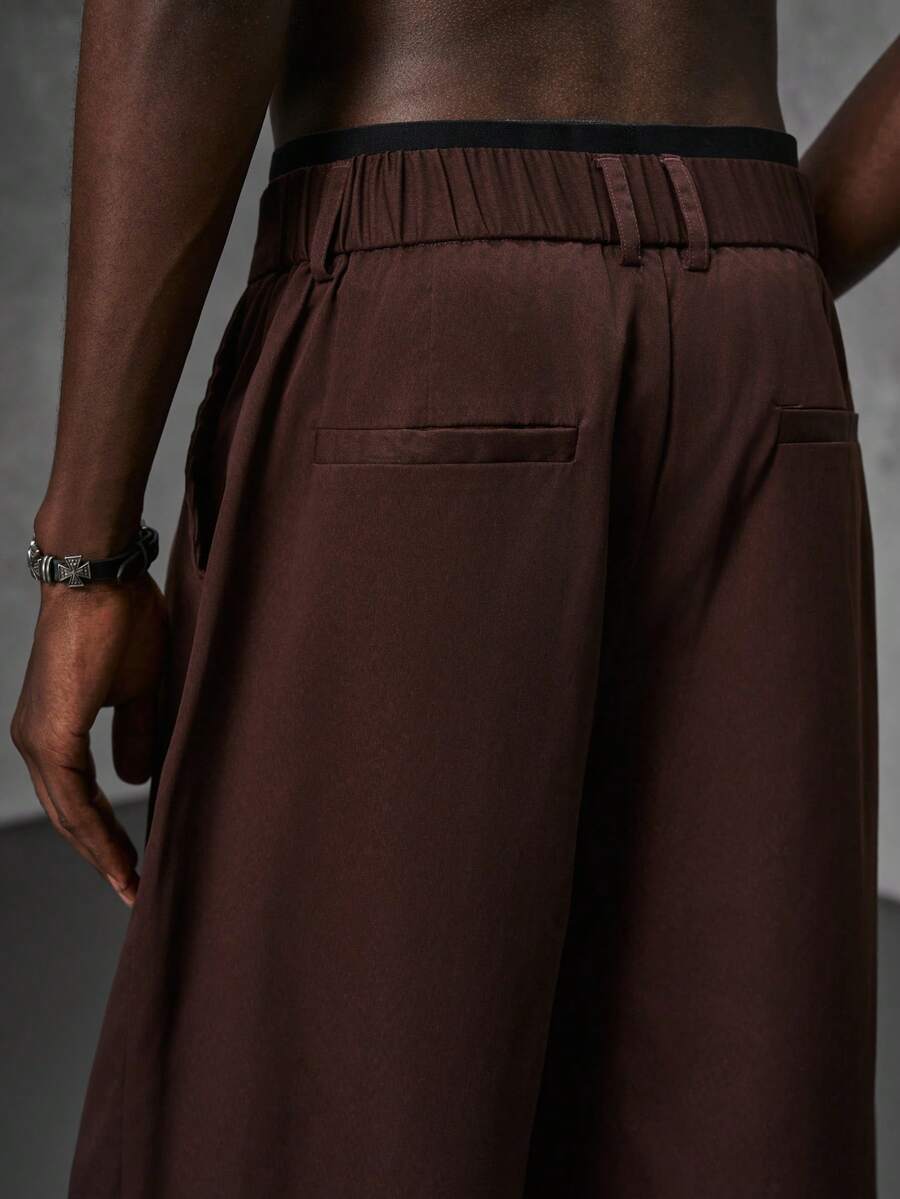 Pantalones de cintura alta y pierna ancha para hombre con frente plisado