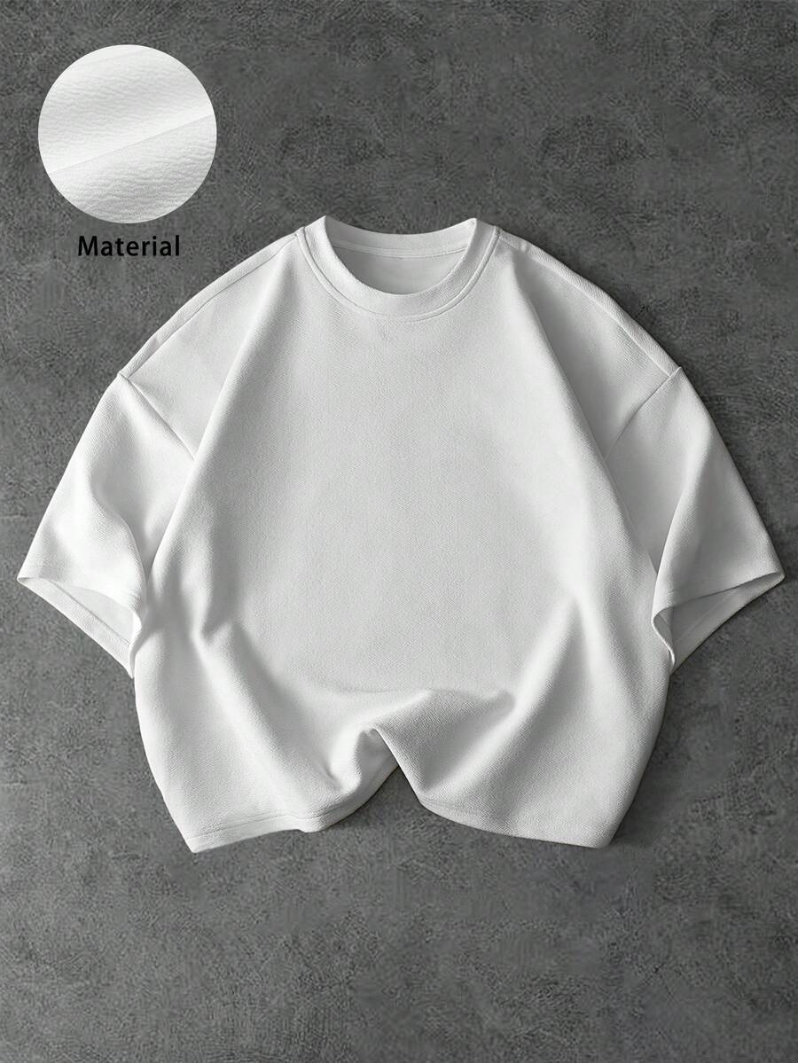 Camiseta suelta de hombro caído con estampado de letras casual para hombre