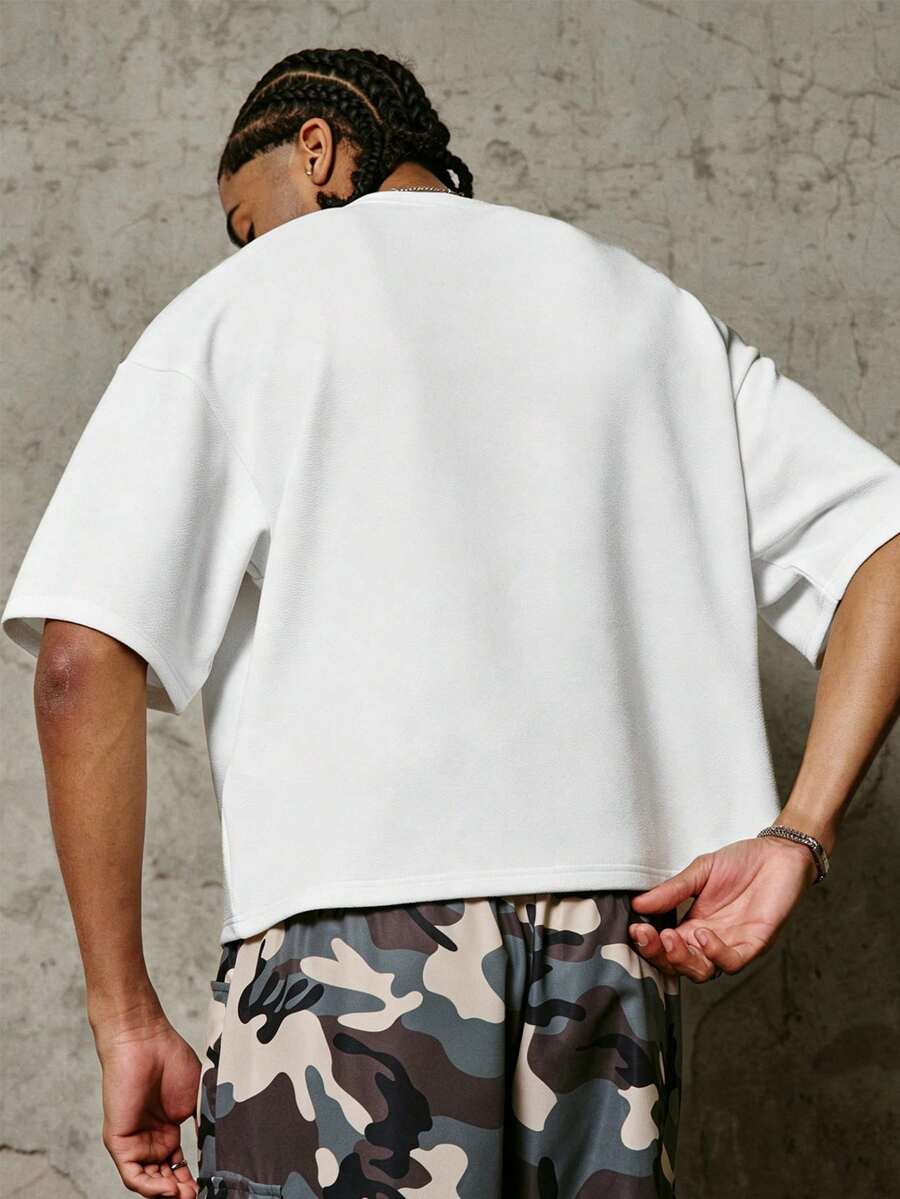 Camiseta suelta de hombro caído con estampado de letras casual para hombre