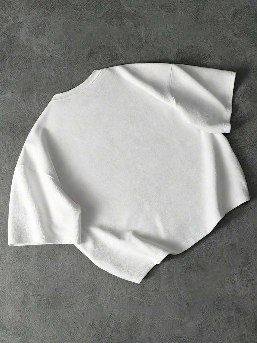 Camiseta suelta de hombro caído con estampado de letras casual para hombre