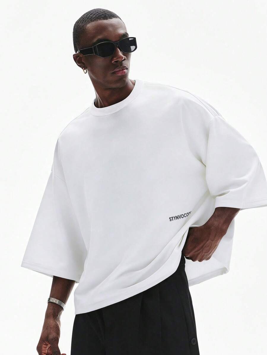 Camiseta suelta de hombro caído con estampado de letras casual para hombre