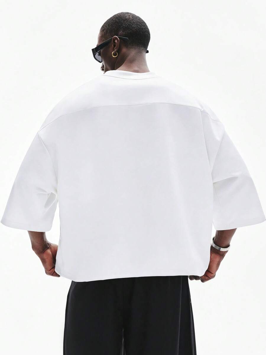Camiseta suelta de hombro caído con estampado de letras casual para hombre